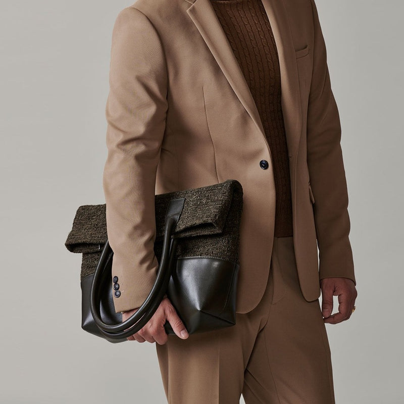 man holding Milano bag